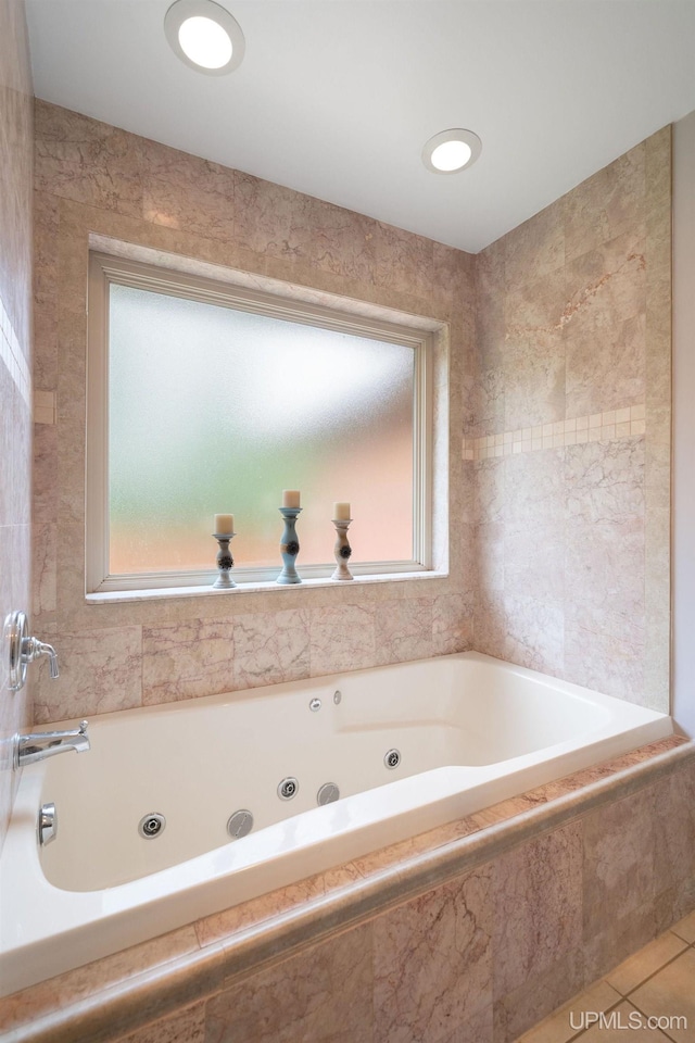 821 Camelot Dr, Negaunee, MI 49866 - bathroom with a tub with jets and tile patterned flooring