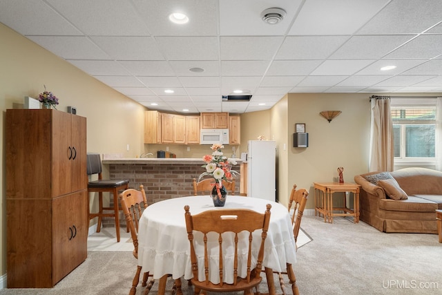 821 Camelot Dr, Negaunee, MI 49866 - dining area featuring light carpet, a drop ceiling, and recessed lighting