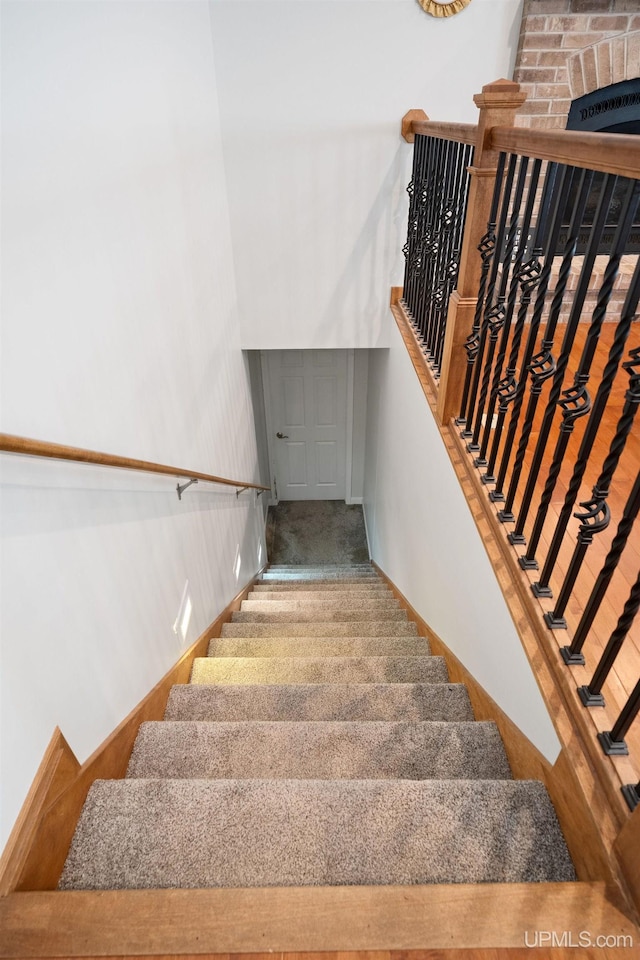 821 Camelot Dr, Negaunee, MI 49866 - staircase with baseboards and carpet