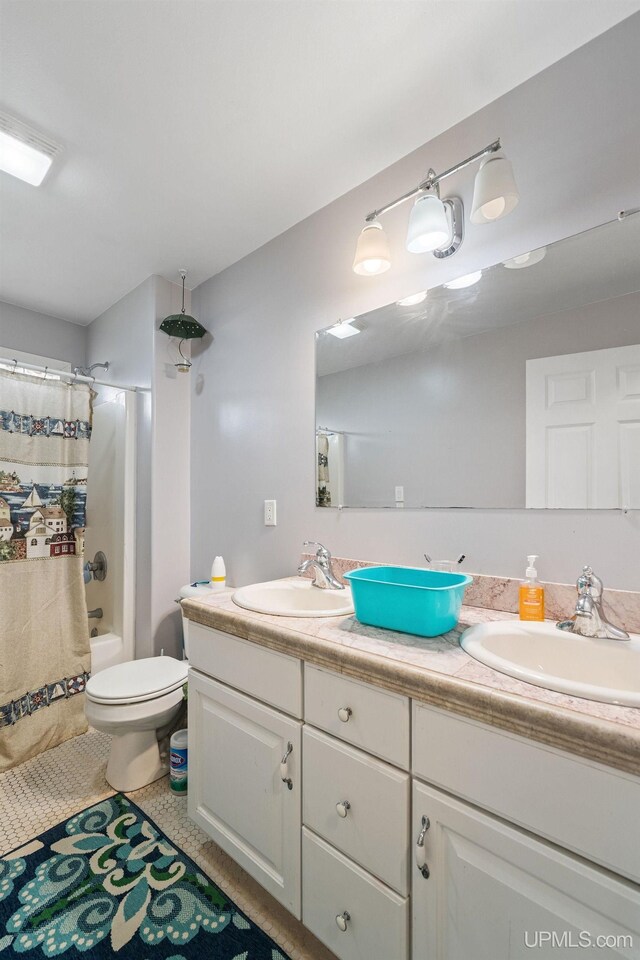 821 Camelot Dr, Negaunee, MI 49866 - full bath featuring double vanity and shower / bath combo