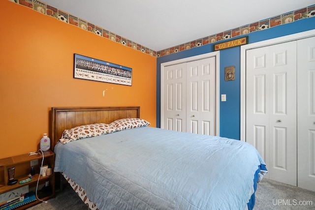 821 Camelot Dr, Negaunee, MI 49866 - carpeted bedroom featuring multiple closets