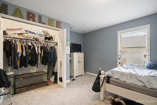 821 Camelot Dr, Negaunee, MI 49866 - carpeted bedroom with a closet and baseboards