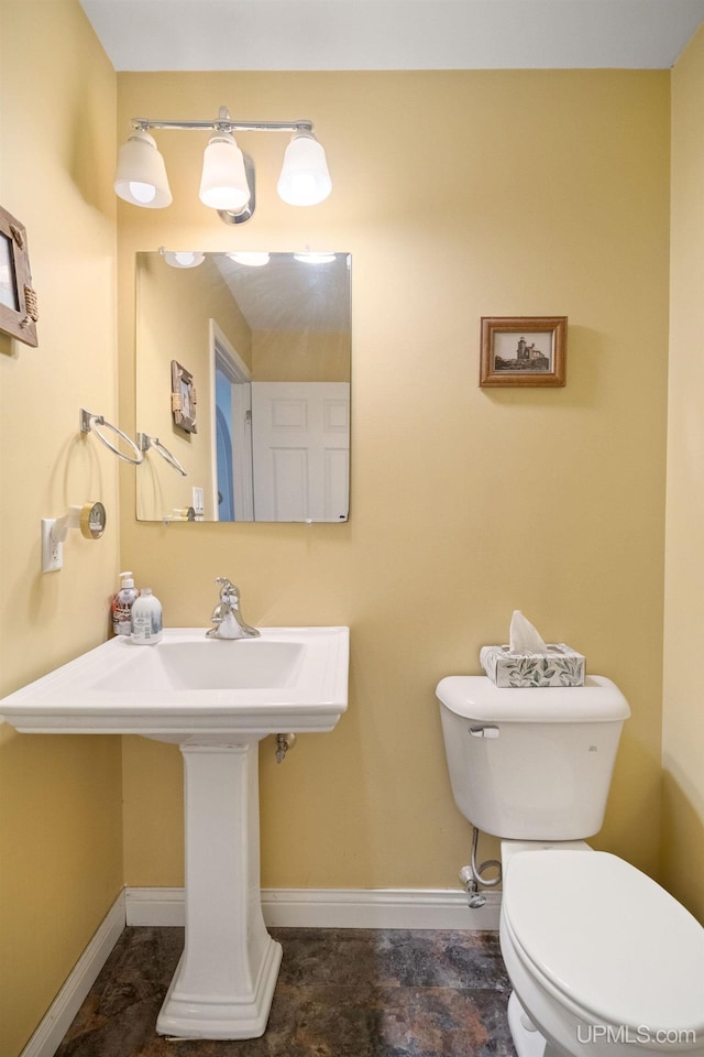 821 Camelot Dr, Negaunee, MI 49866 - bathroom featuring toilet and baseboards