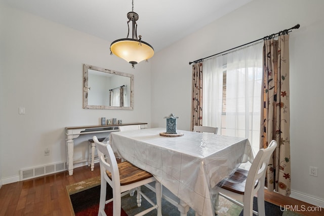 821 Camelot Dr, Negaunee, MI 49866 - dining space with wood finished floors and baseboards