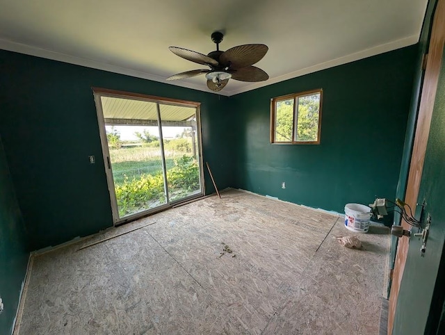 304 Beech St, Kawkawlin, MI 48706 - empty room featuring crown molding and a ceiling fan