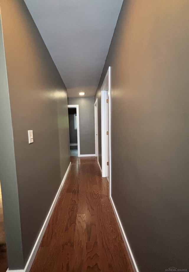 10301 County Farm Rd, Parma, MI 49269 - hall with wood finished floors and baseboards
