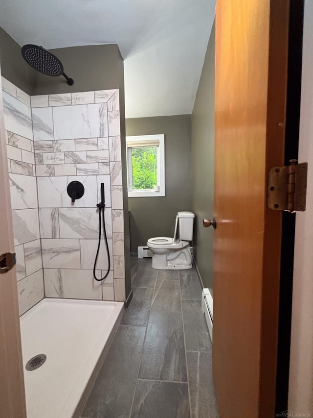 10301 County Farm Rd, Parma, MI 49269 - full bathroom featuring baseboard heating and a tile shower