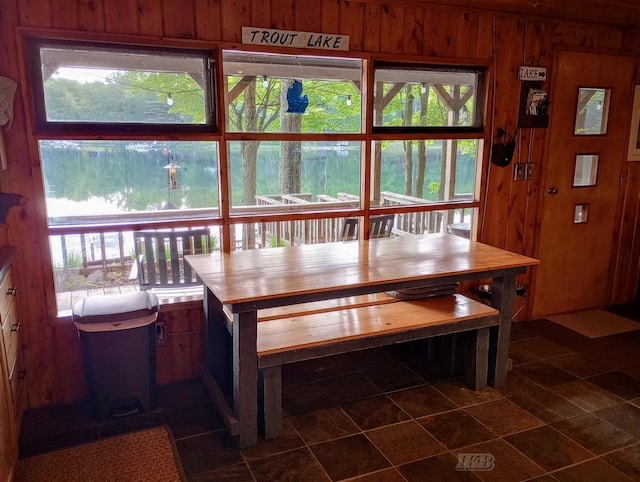 801 W Rd, Harrison, MI 48625 - dining area with wood walls and healthy amount of natural light