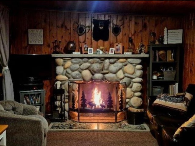 801 W Rd, Harrison, MI 48625 - living area with a stone fireplace and wooden walls