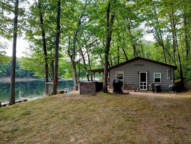 801 W Rd, Harrison, MI 48625 - view of yard featuring a deck with water view