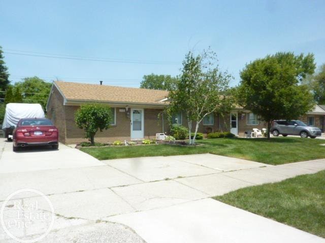 20127 14 Mile Rd, Clinton Township, MI 48035 - ranch-style house with concrete driveway and a front yard
