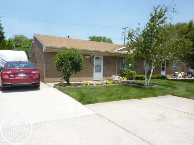 20127 14 Mile Rd, Clinton Township, MI 48035 - ranch-style house with a front yard, driveway, and brick siding