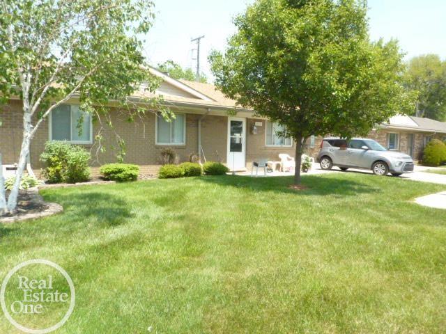20127 14 Mile Rd, Clinton Township, MI 48035 - view of front facade with a front lawn and brick siding