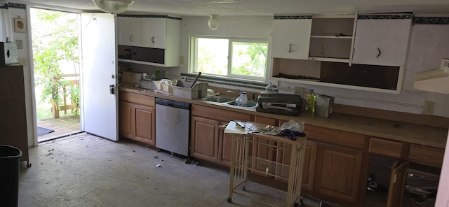 2920 Lauria Rd, Kawkawlin, MI 48706 - kitchen with dishwasher, open shelves, brown cabinetry, and light countertops