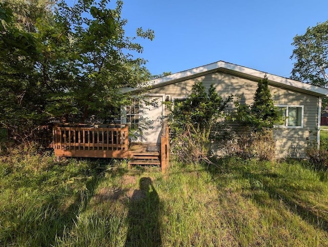 2920 Lauria Rd, Kawkawlin, MI 48706 - back of house with a wooden deck