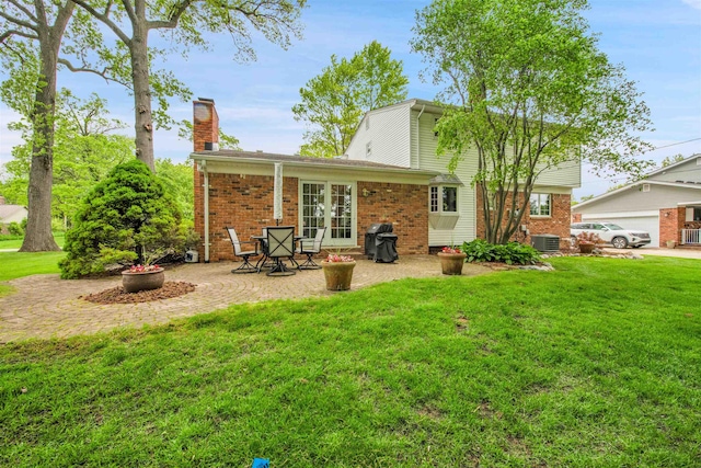 4112 Adams Dr, Shelby Twp, MI 48316 - back of property featuring french doors, a chimney, a lawn, and brick siding
