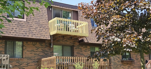 38544 Lanse Creuse St Unit 12, Harrison Twp, MI 48045 - view of side of home with a balcony and brick siding