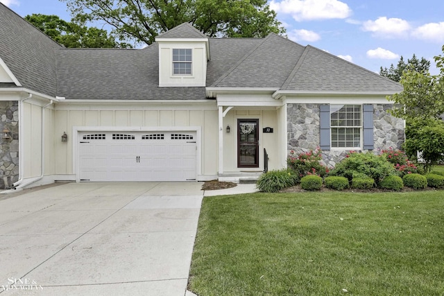 32 River Ln, Grosse Pointe Woods, MI 48236 - view of front of house featuring board and batten siding, a shingled roof, stone siding, and an attached garage