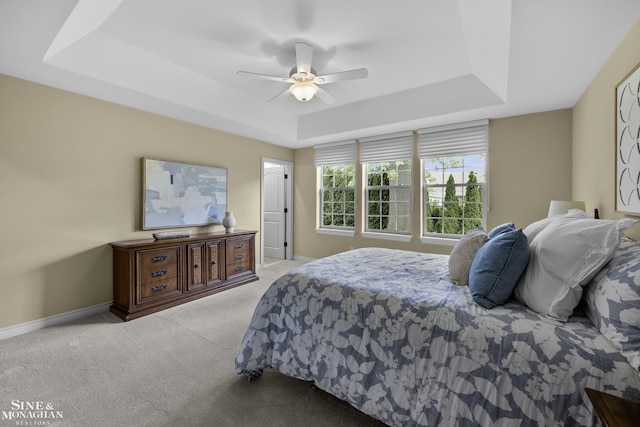 32 River Ln, Grosse Pointe Woods, MI 48236 - bedroom featuring a tray ceiling, carpet flooring, and ceiling fan