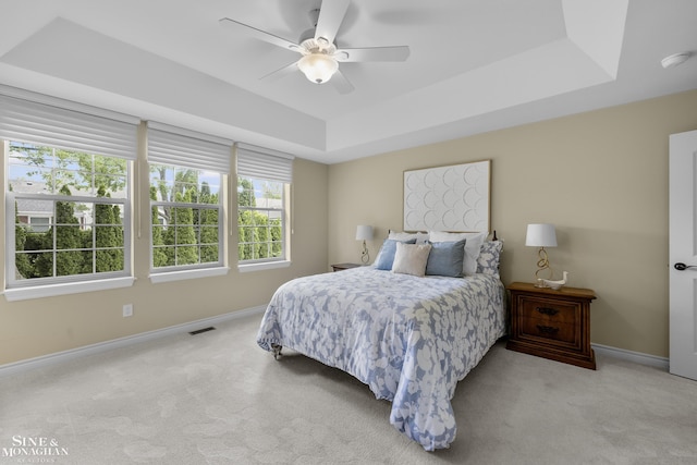 32 River Ln, Grosse Pointe Woods, MI 48236 - bedroom with a tray ceiling, carpet flooring, and ceiling fan
