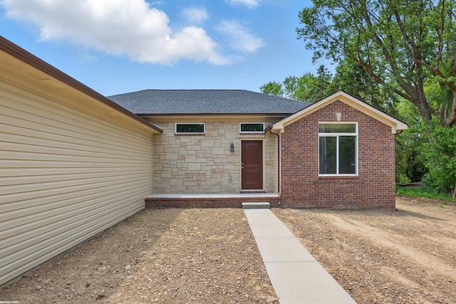 36217 Little Mack Ave, Clinton Township, MI 48035 - entrance to property with a shingled roof and stone siding
