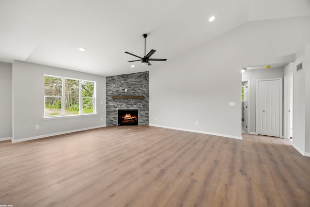 36217 Little Mack Ave, Clinton Township, MI 48035 - unfurnished living room with ceiling fan, wood finished floors, a fireplace, recessed lighting, and vaulted ceiling
