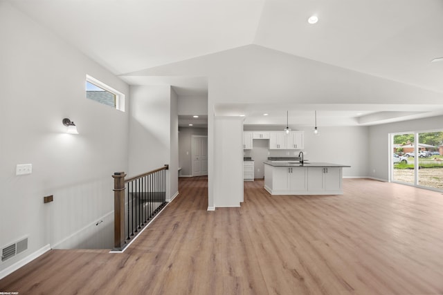 36217 Little Mack Ave, Clinton Township, MI 48035 - unfurnished living room featuring light wood-style floors, lofted ceiling, and recessed lighting