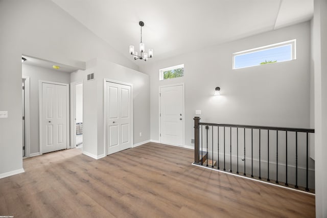 36217 Little Mack Ave, Clinton Township, MI 48035 - foyer featuring a chandelier, wood finished floors, and lofted ceiling