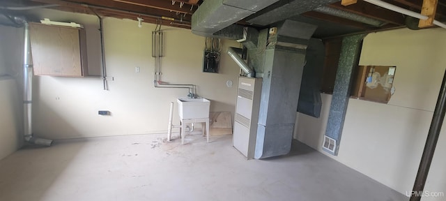 113 Albatross St, Gwinn, MI 49841 - basement featuring heating unit and a sink