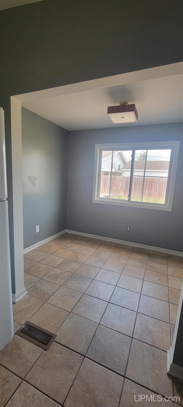 113 Albatross St, Gwinn, MI 49841 - unfurnished room featuring baseboards and light tile patterned floors