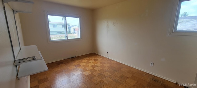 113 Albatross St, Gwinn, MI 49841 - unfurnished bedroom featuring baseboards and light floors