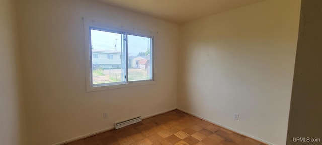 113 Albatross St, Gwinn, MI 49841 - unfurnished room with a baseboard radiator and baseboards