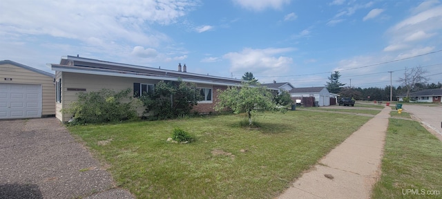 113 Albatross St, Gwinn, MI 49841 - view of front of property featuring a front lawn and a garage