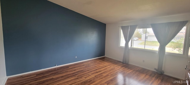 113 Albatross St, Gwinn, MI 49841 - empty room with dark wood-style flooring and baseboards