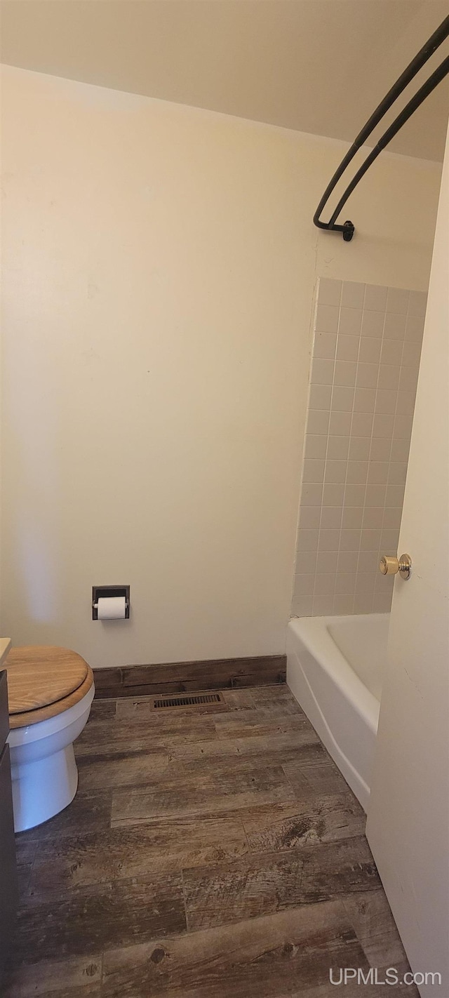 113 Albatross St, Gwinn, MI 49841 - bathroom featuring wood finished floors and bathing tub / shower combination