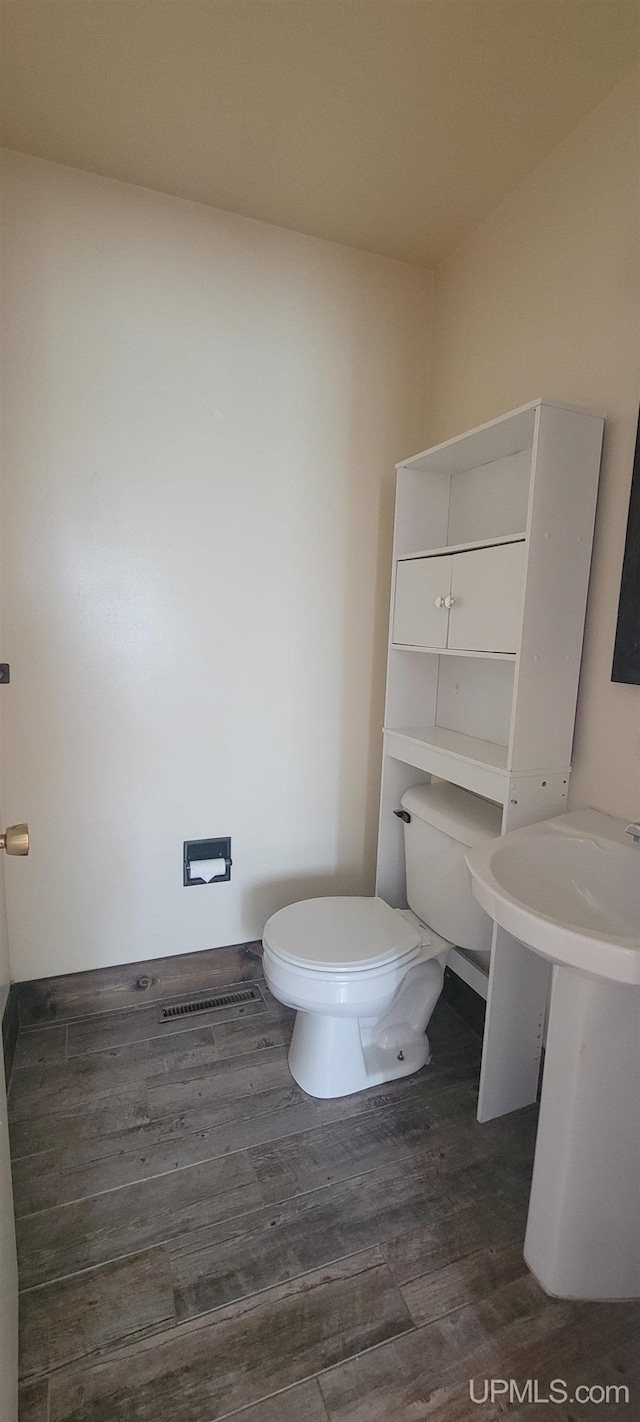 113 Albatross St, Gwinn, MI 49841 - half bathroom with wood finished floors