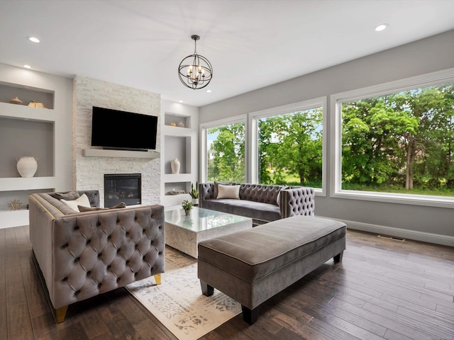 4661 Applewood Ct, Rochester, MI 48306 - living room featuring built in features, dark wood finished floors, a chandelier, a fireplace, and recessed lighting