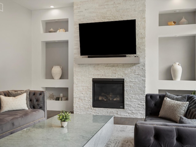 4661 Applewood Ct, Rochester, MI 48306 - living area with wood finished floors, built in shelves, and a fireplace