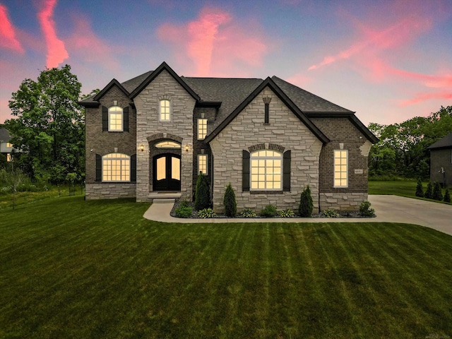 4661 Applewood Ct, Rochester, MI 48306 - french country home featuring stone siding, a yard, and a shingled roof