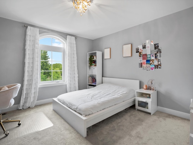 4661 Applewood Ct, Rochester, MI 48306 - carpeted bedroom with baseboards and a chandelier