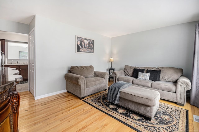 34147 Whittaker St, Clinton Township, MI 48035 - living area with light wood-type flooring and baseboards
