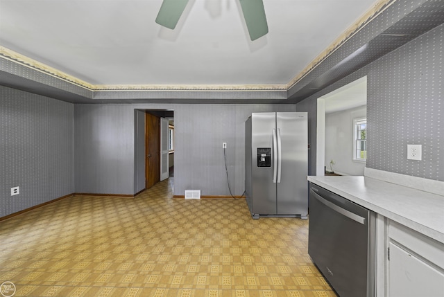 5541 Houghten Dr, Troy, MI 48098 - kitchen featuring stainless steel appliances, light countertops, ceiling fan, light flooring, and white cabinetry
