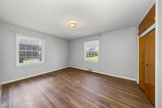 5541 Houghten Dr, Troy, MI 48098 - unfurnished room featuring dark wood-type flooring and baseboards