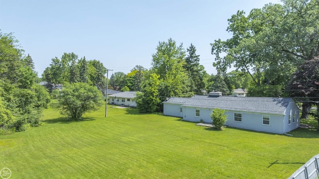 5541 Houghten Dr, Troy, MI 48098 - view of green lawn with view of wooded area