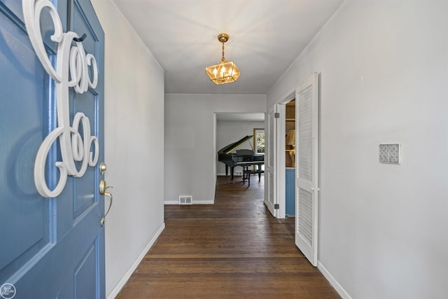 5541 Houghten Dr, Troy, MI 48098 - entryway featuring dark wood-type flooring and a chandelier
