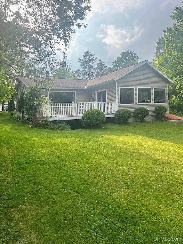 790 N Horseshoe Lake Dr, Gwinn, MI 49841 - back of property with a deck and a yard