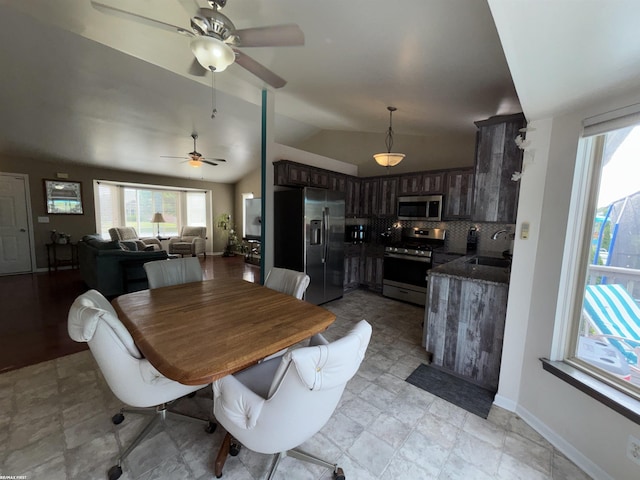 51767 Huntley Ave, New Baltimore, MI 48047 - dining area with ceiling fan, plenty of natural light, and lofted ceiling