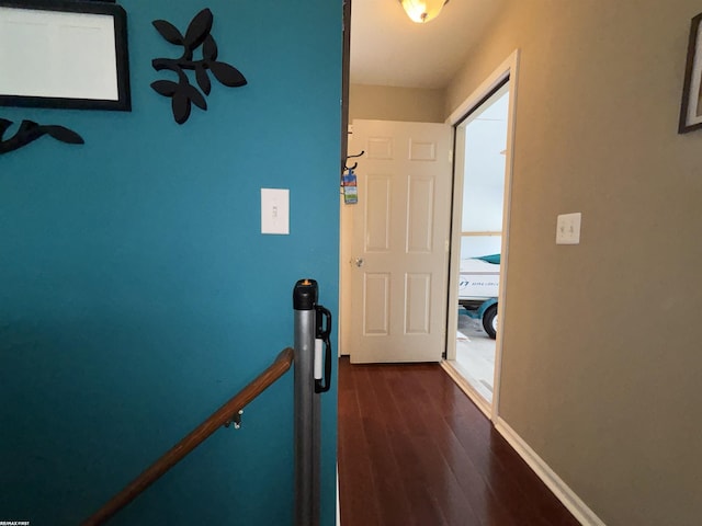 51767 Huntley Ave, New Baltimore, MI 48047 - corridor featuring dark wood-style floors and an upstairs landing