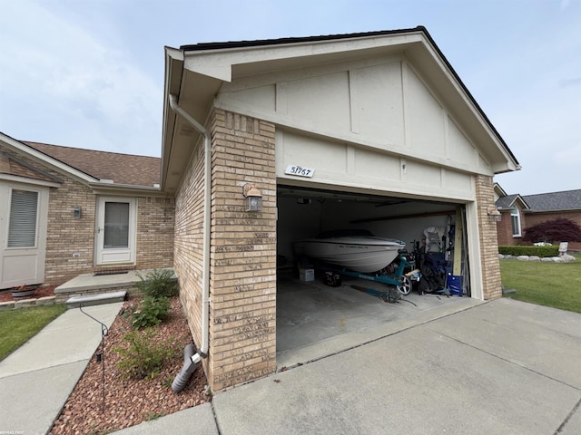 51767 Huntley Ave, New Baltimore, MI 48047 - view of home's exterior with brick siding, concrete driveway, and a garage