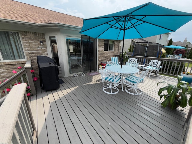 51767 Huntley Ave, New Baltimore, MI 48047 - wooden deck featuring outdoor dining space and grilling area